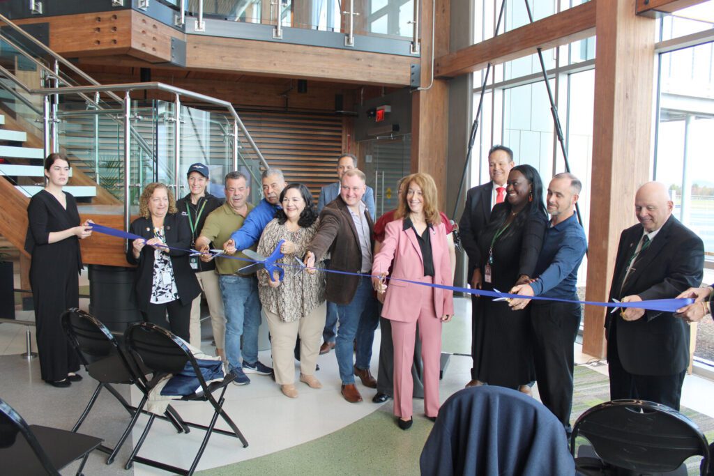 County legislators join New York DOT Commissioner Marie Therese Dominguez and Assemblywoman Paula Kay in cutting the ribbon for the new Sullivan County International Airport in Swan Lake.
Photo Credit: Vincent Kurzrock | Democrat