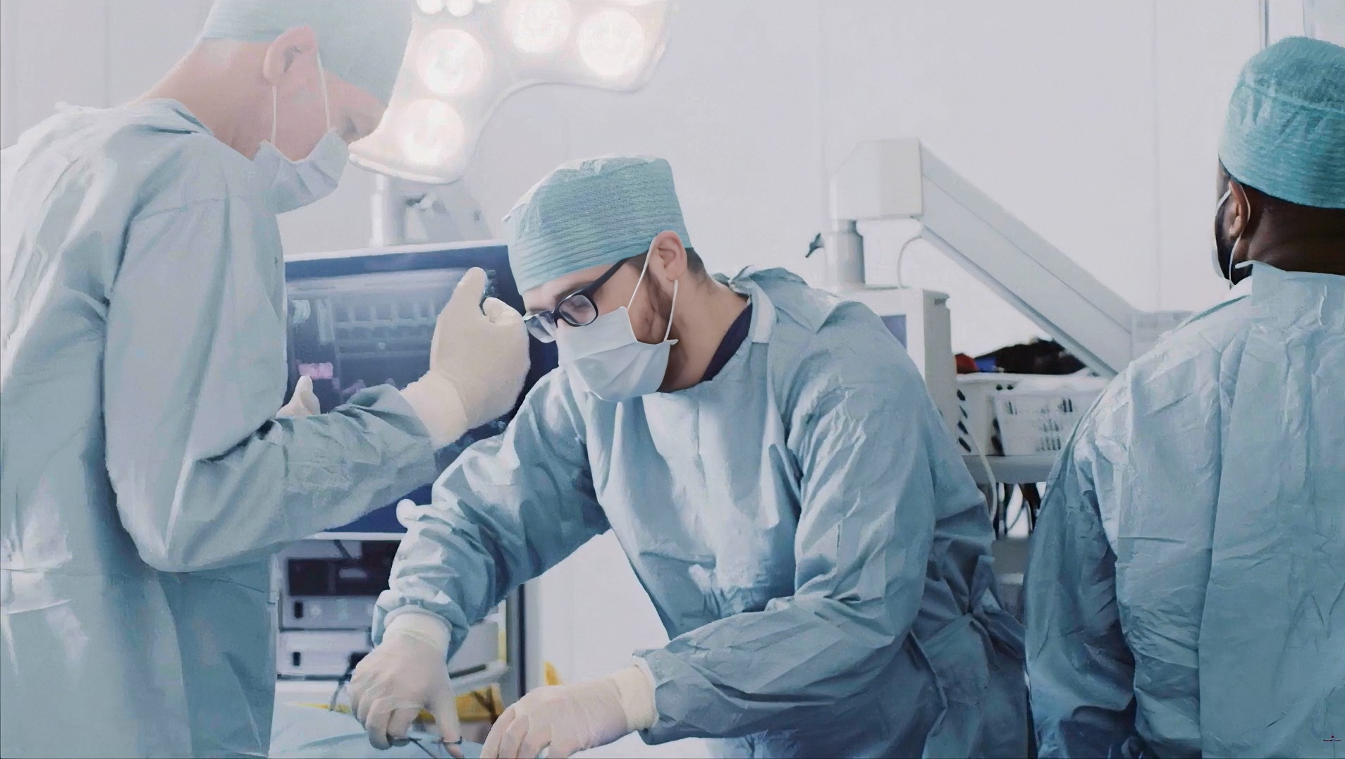 Surgeon working on patient in hospital setting